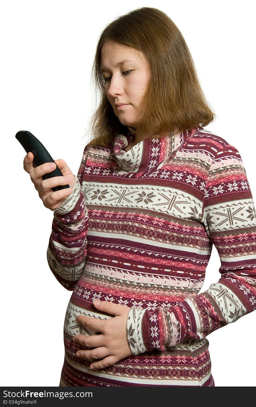 Pregnant woman with phone over white