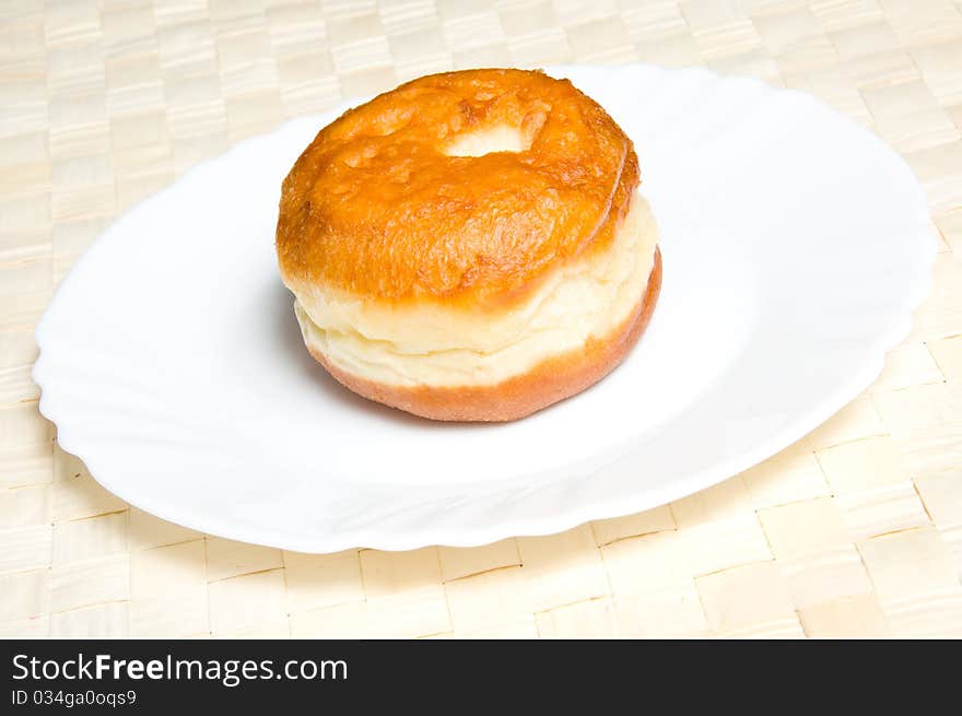 One appetizing doughnut on plate