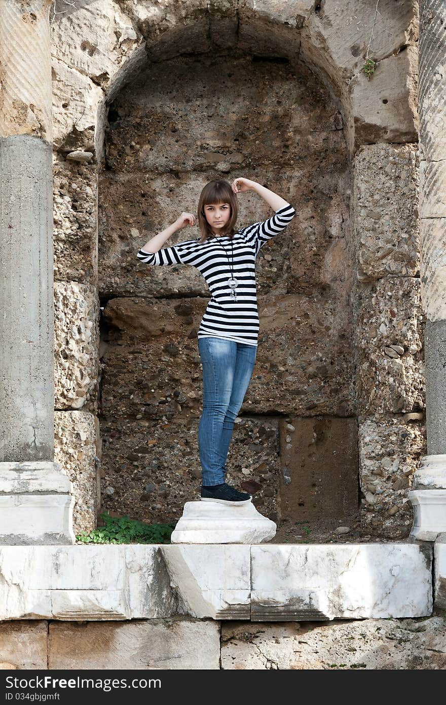 The girl in the ruins of the statue depicts