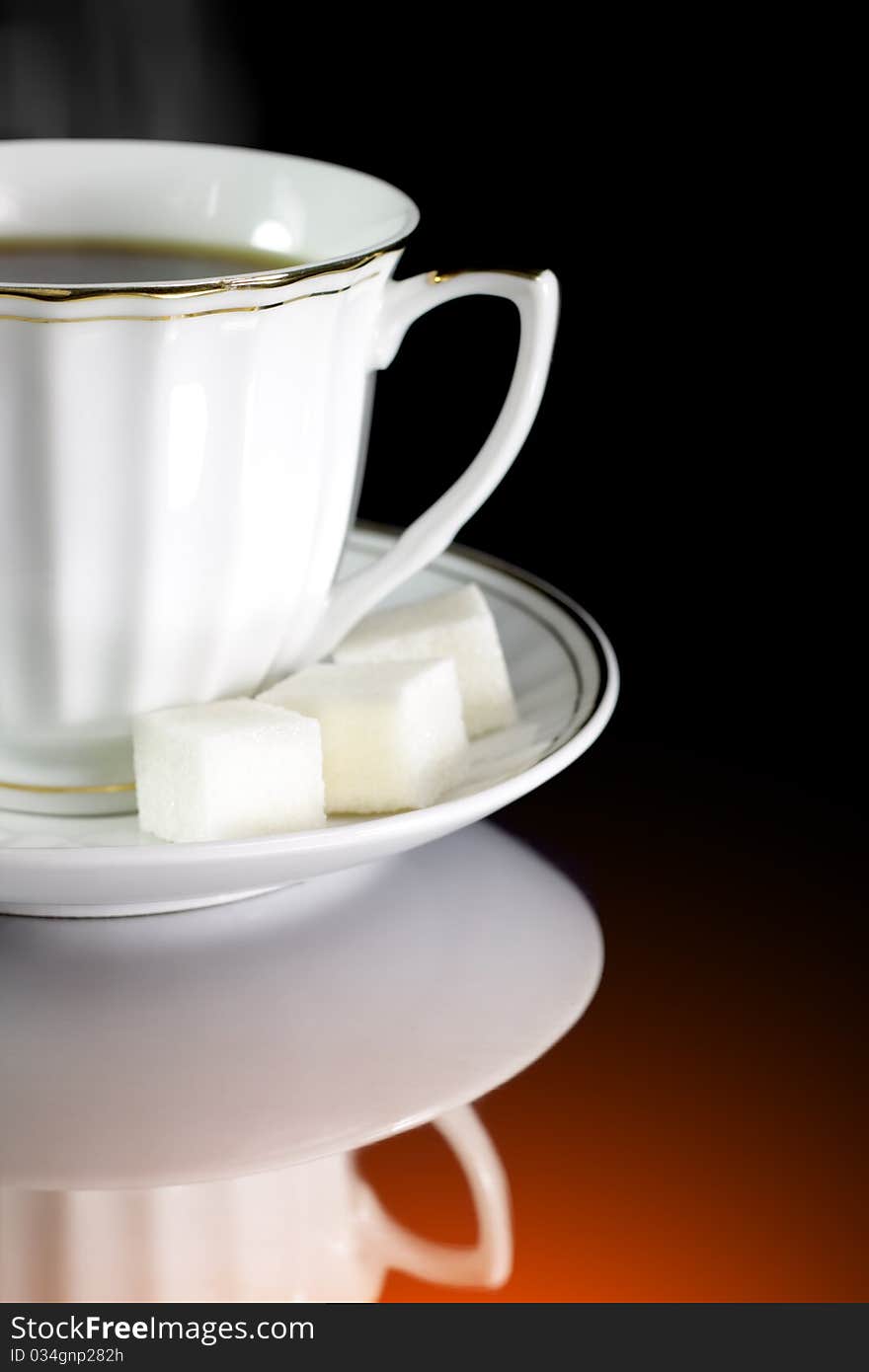 Cup of coffee on a black background