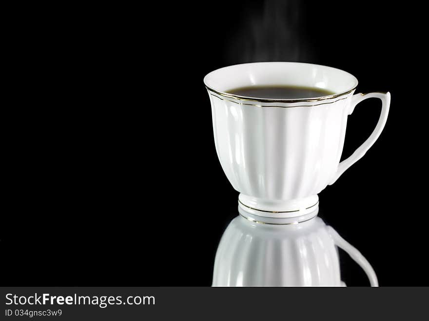 Cup of coffee on a black background