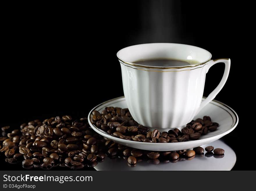 Cup of coffee on a black background