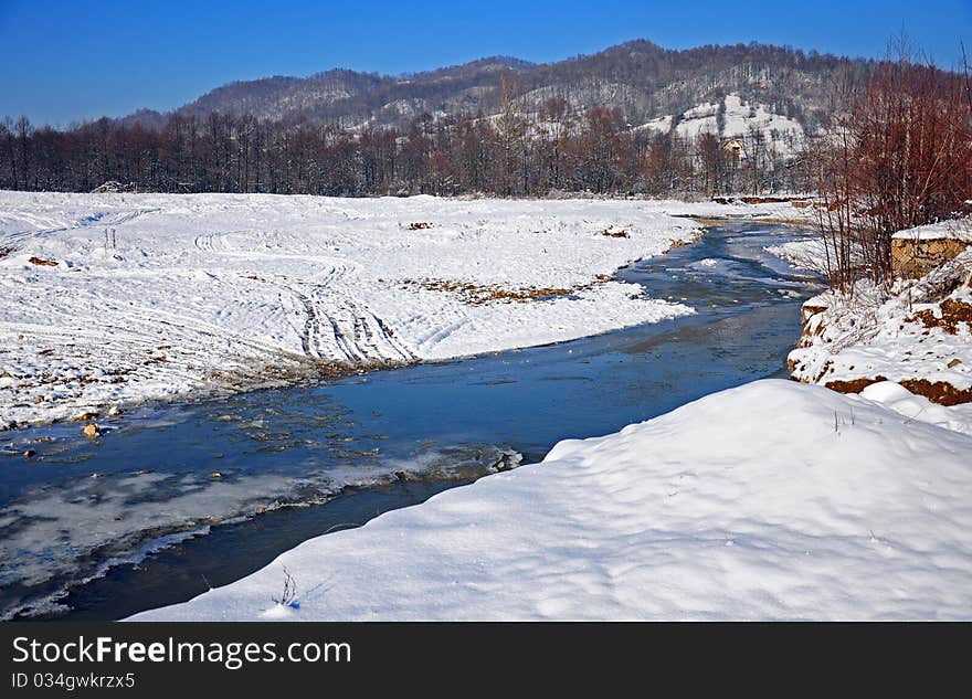 Transversing river in winter day