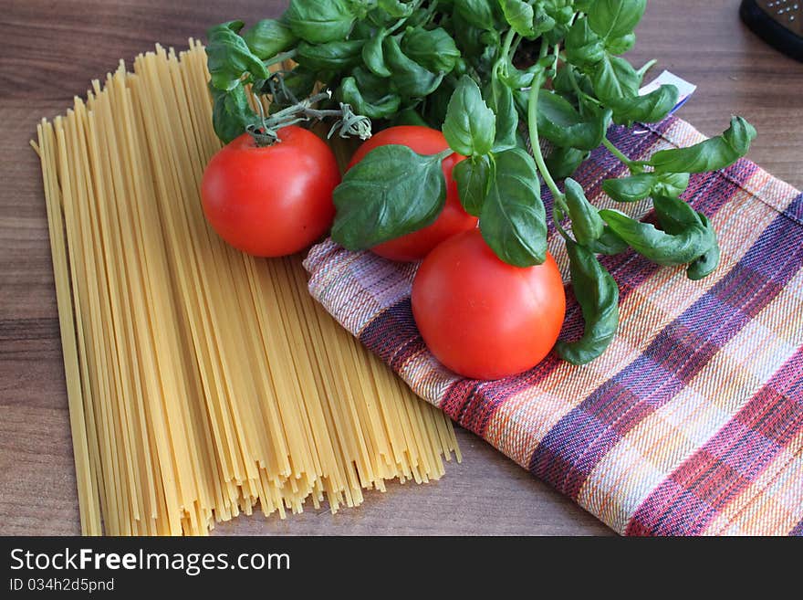 Ingredient for Italian pasta with tomato and basil spaghetti. Ingredient for Italian pasta with tomato and basil spaghetti