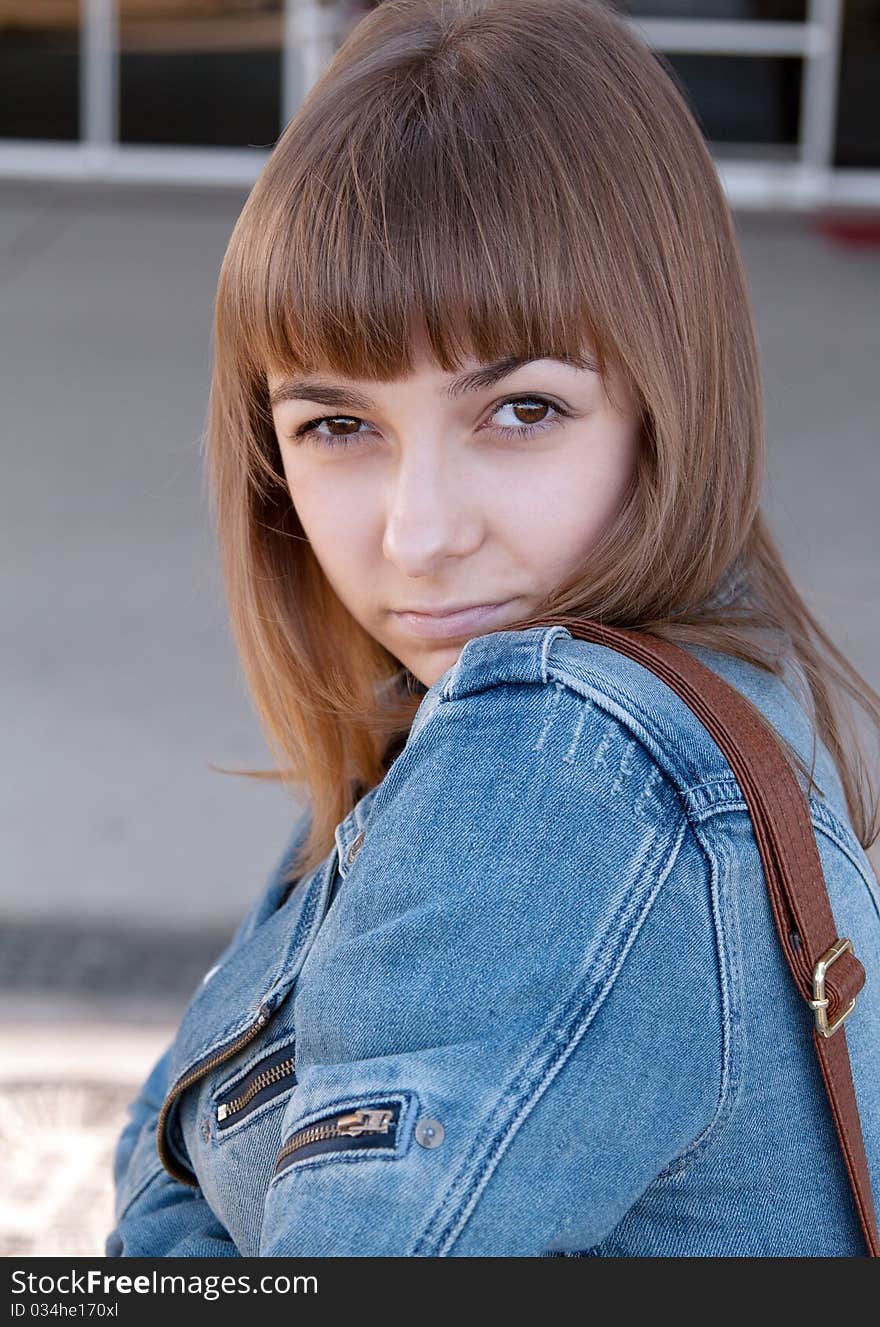 Portrait of a young girl in a denim jacket