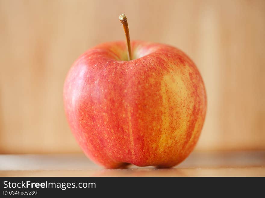 Red apple on rustic wood