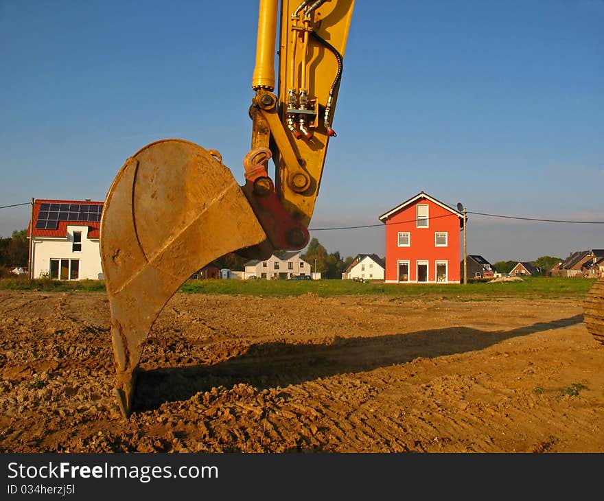 Excavator in the development  area in Germany