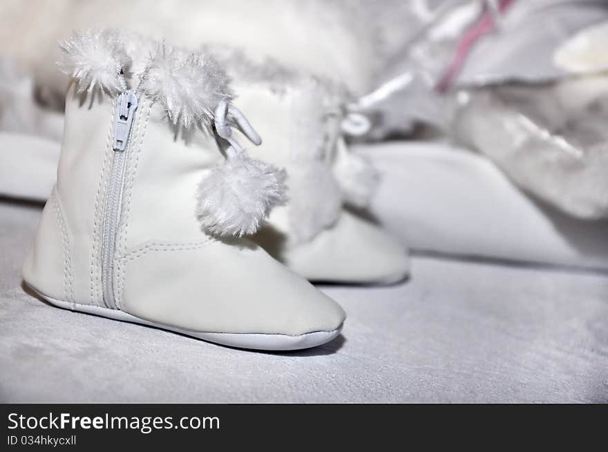 New-born little, white and fluffy footwear. New-born little, white and fluffy footwear