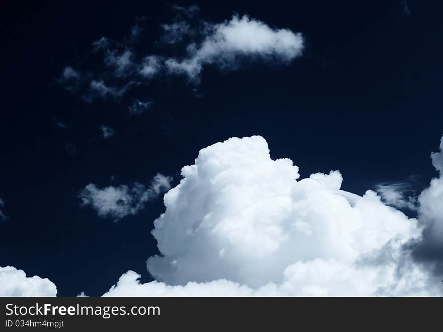 White clouds and dark sky. White clouds and dark sky