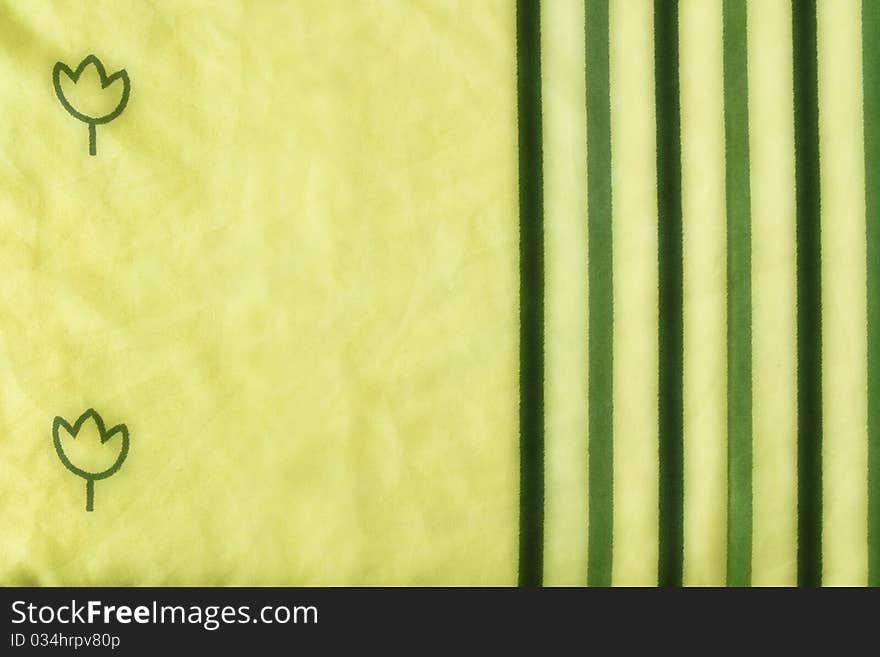 Yellow fabric with green flowers and lines