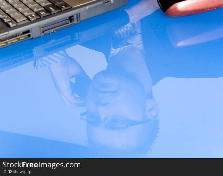 Elegant man sits at his desk. Businessman talking on the phone.