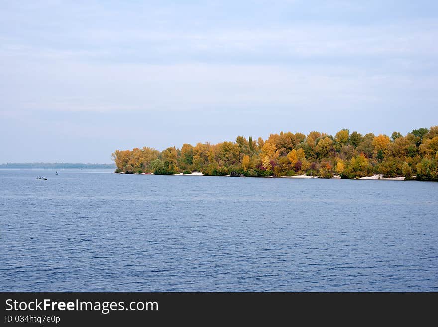 Colorful autumn trees at the river bank. Colorful autumn trees at the river bank