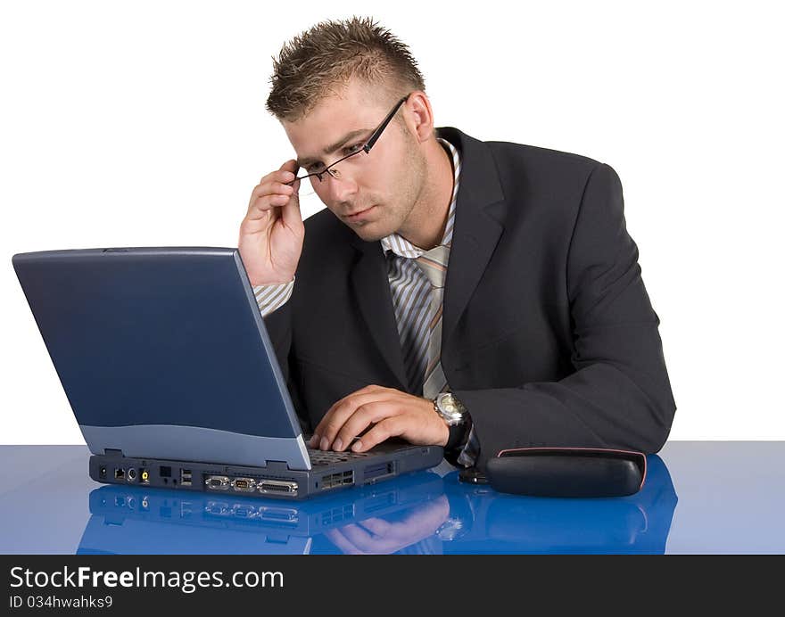 Elegant man sits at his desk. Businessman talking on the phone.