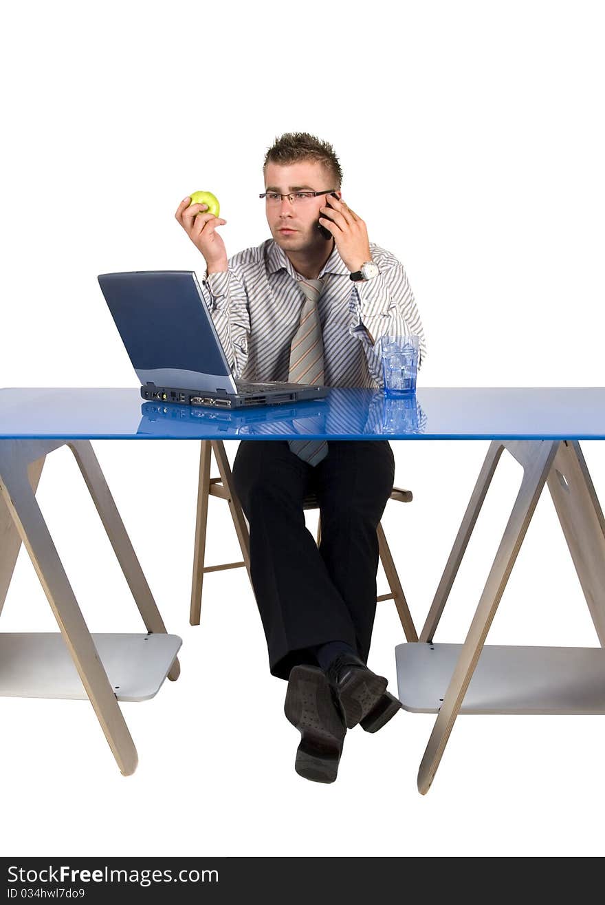 Elegant man sits at his desk. Businessman talking on the phone.