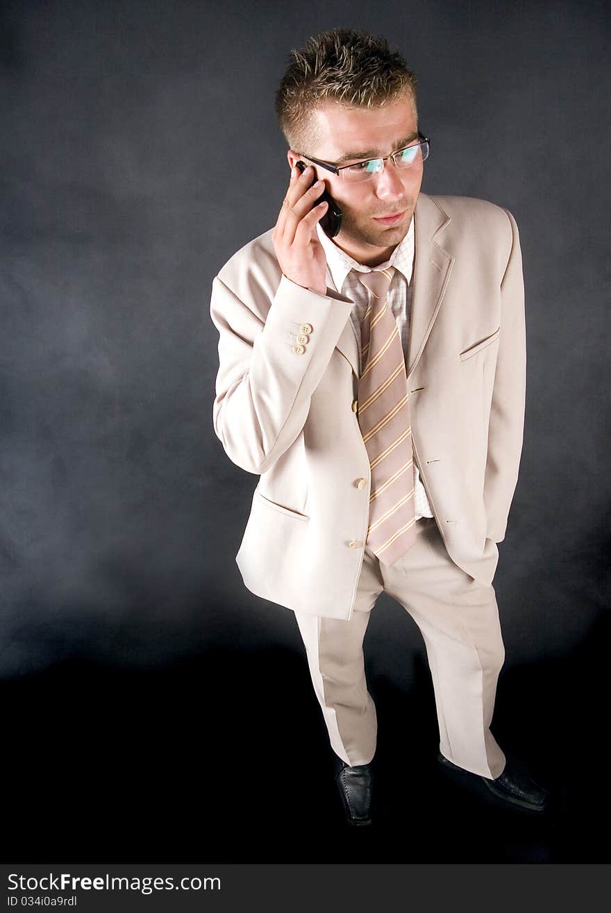 Elegant businessman working on his office and  smoking cigar. Elegant businessman working on his office and  smoking cigar.