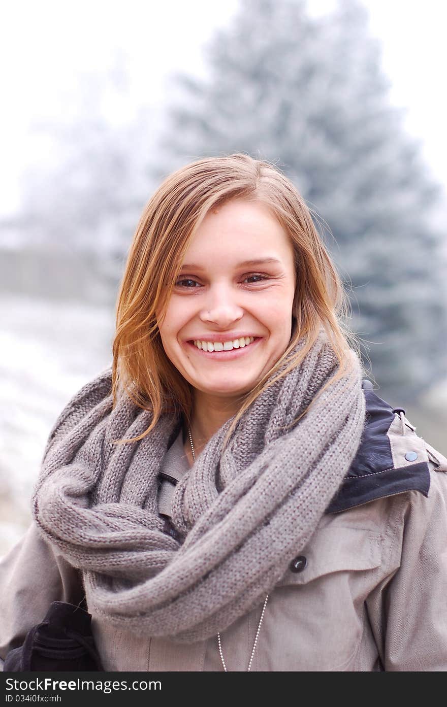 Outdoor winter portrait of a beautiful young woman