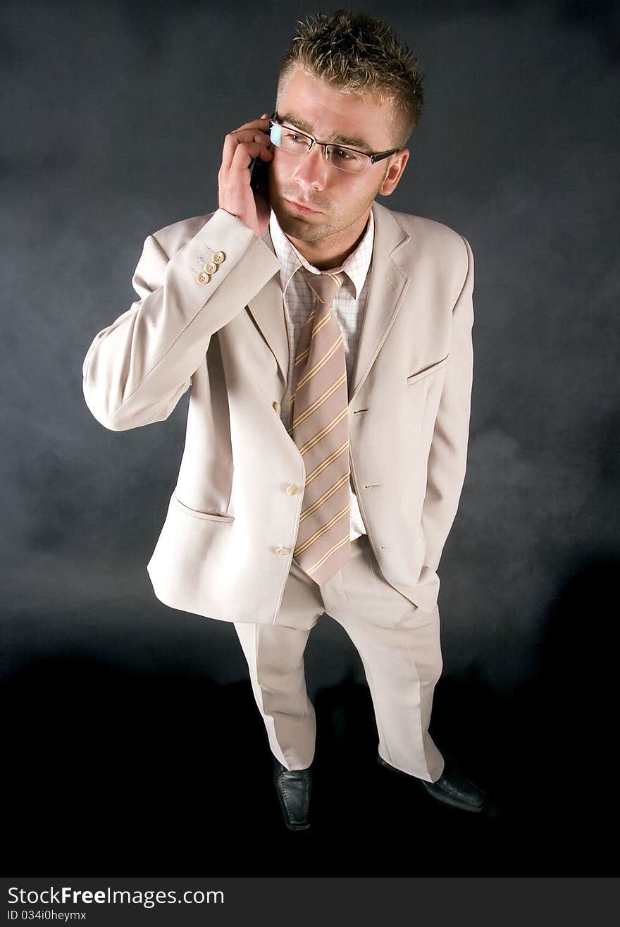 Elegant businessman working on his office and  smoking cigar. Elegant businessman working on his office and  smoking cigar.