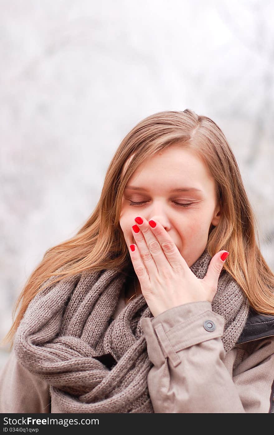 Outdoor winter portrait of a beautiful young woman