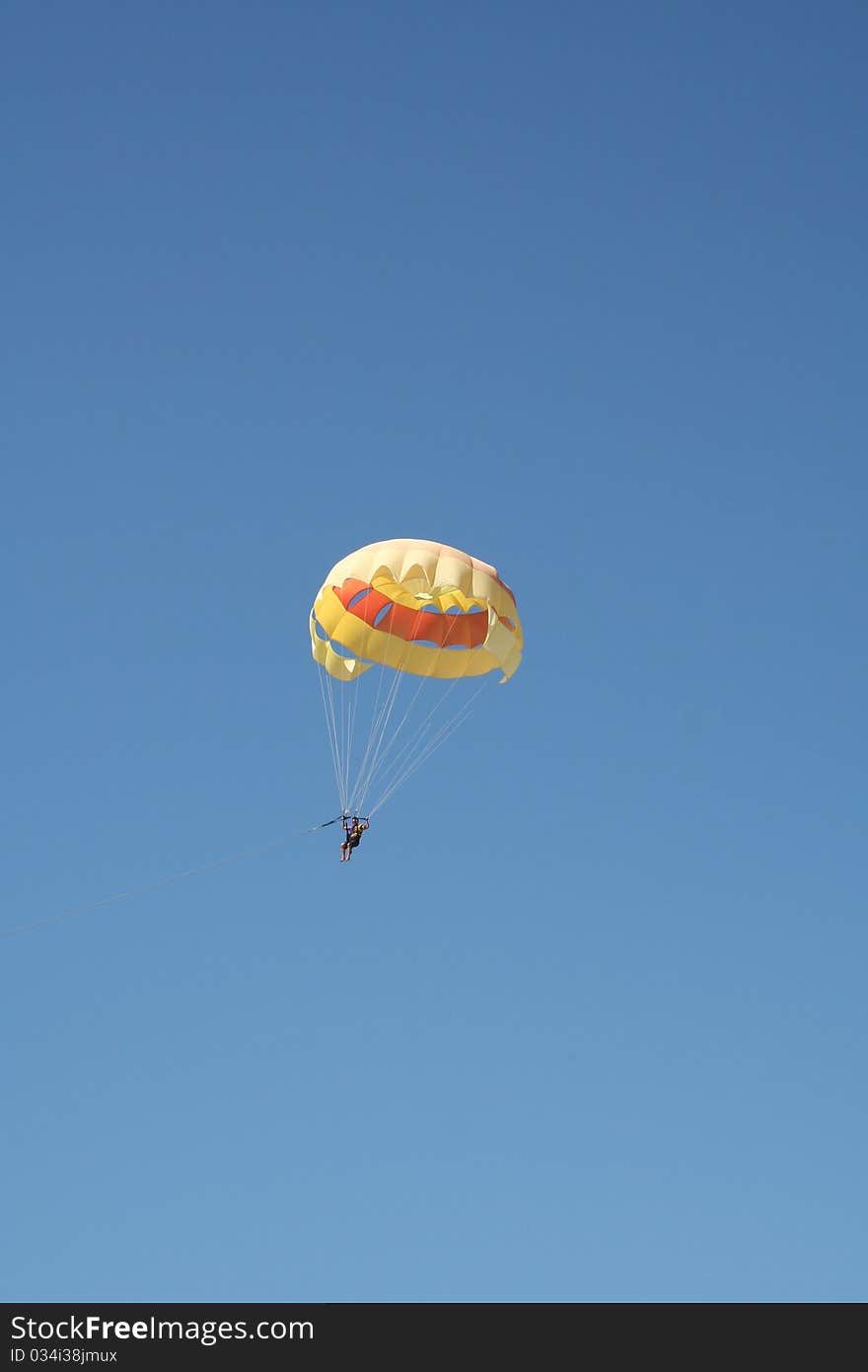 Parasailing Against Blue Sky