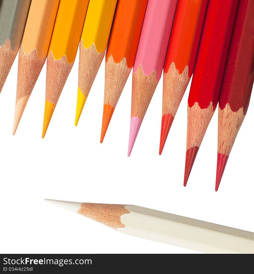 Top view of Hot tone color pencil and white color pencil on white background isolated