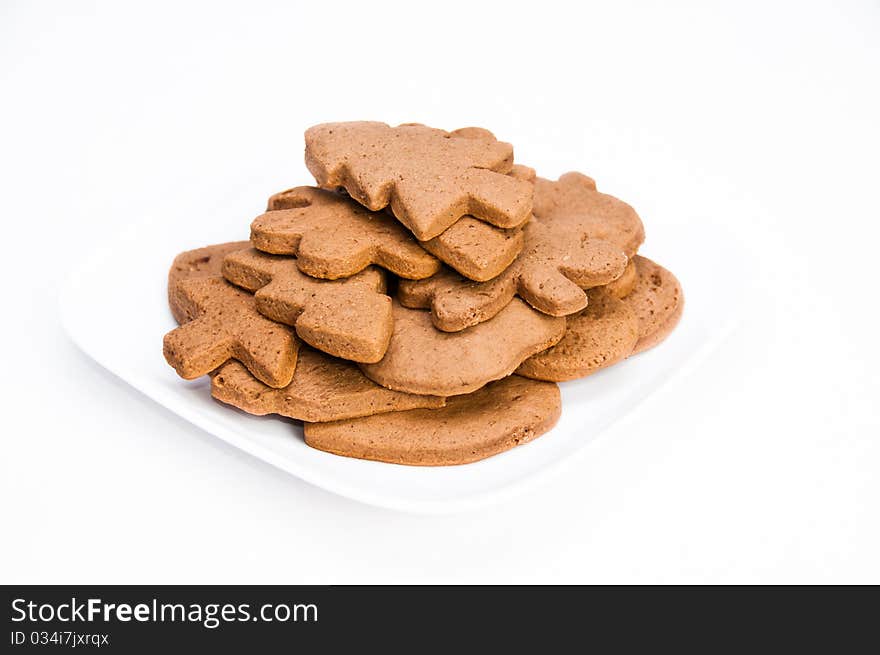 Plate of tasty homemade gingerbread cookies on isolating background. Plate of tasty homemade gingerbread cookies on isolating background