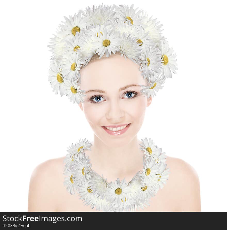 Natural beauty girl with good skin smiles the head and neck decoration of daisies. Natural beauty girl with good skin smiles the head and neck decoration of daisies