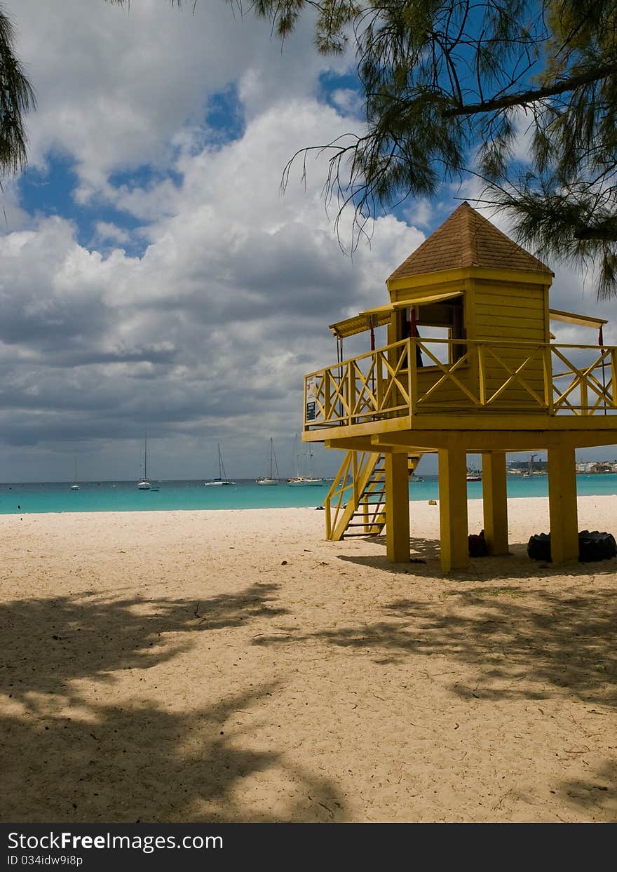 A yellow lifeguard watch tower on Barbados. A yellow lifeguard watch tower on Barbados.