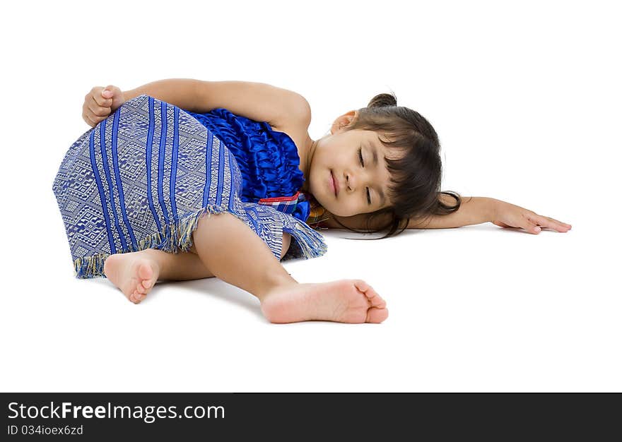 Cute little girl laying on the floor with eyes closed, isolated on white background. Cute little girl laying on the floor with eyes closed, isolated on white background