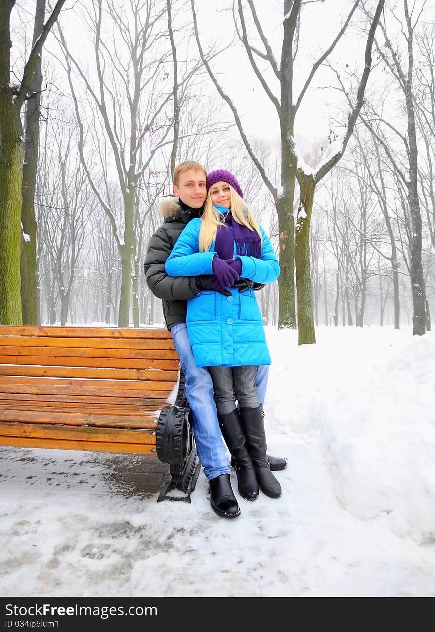 Young adult couple in the park. Winter.