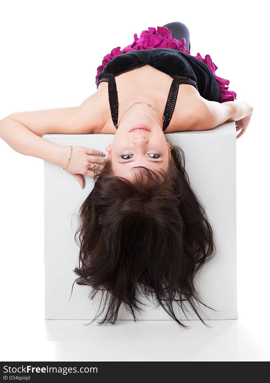 A girl is laying on her back. isolated on white