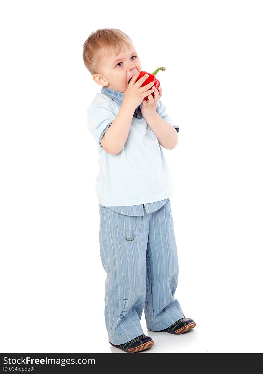 Boy with sweet pepper. Isolated on white