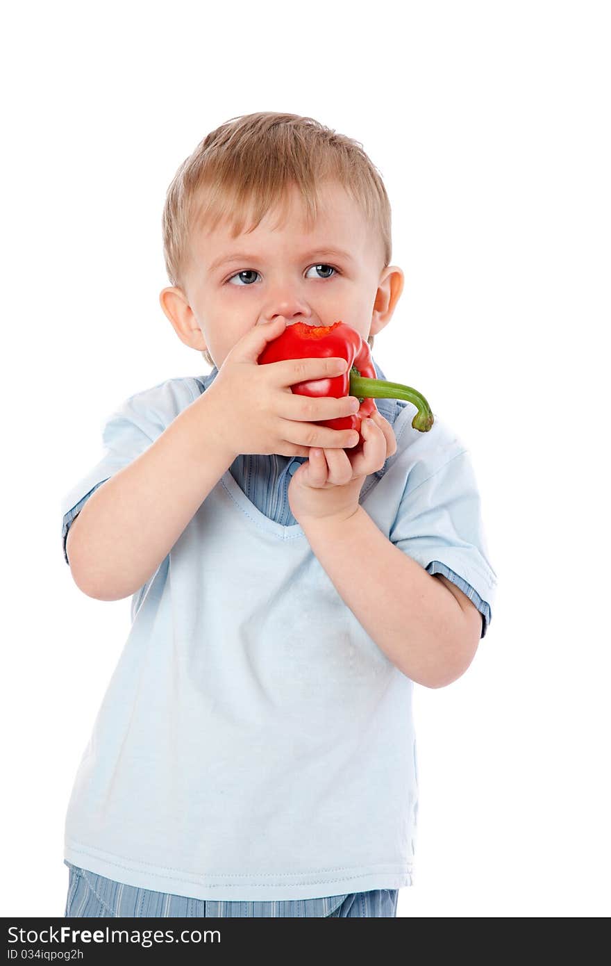 Boy with sweet pepper. Isolated on white