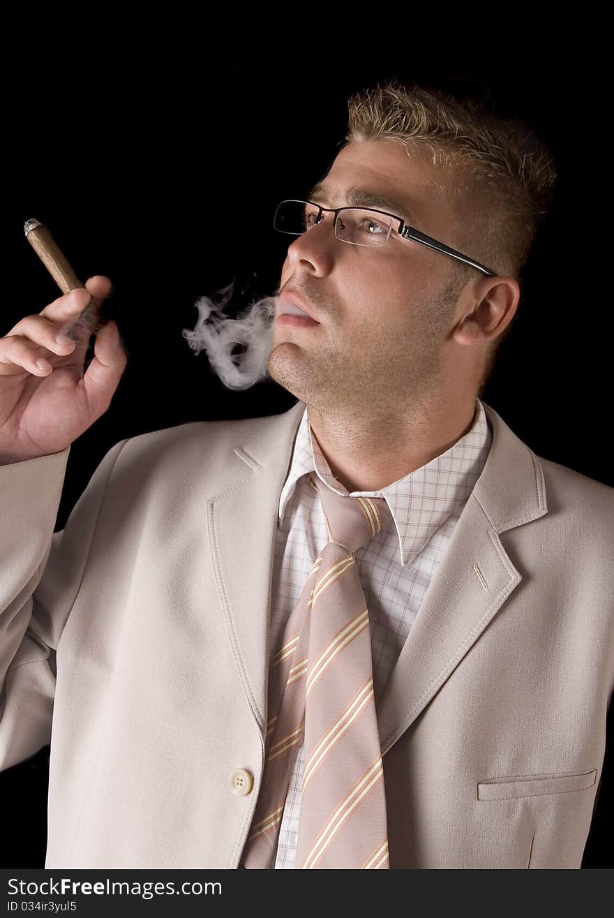 Businessman smoking cigar