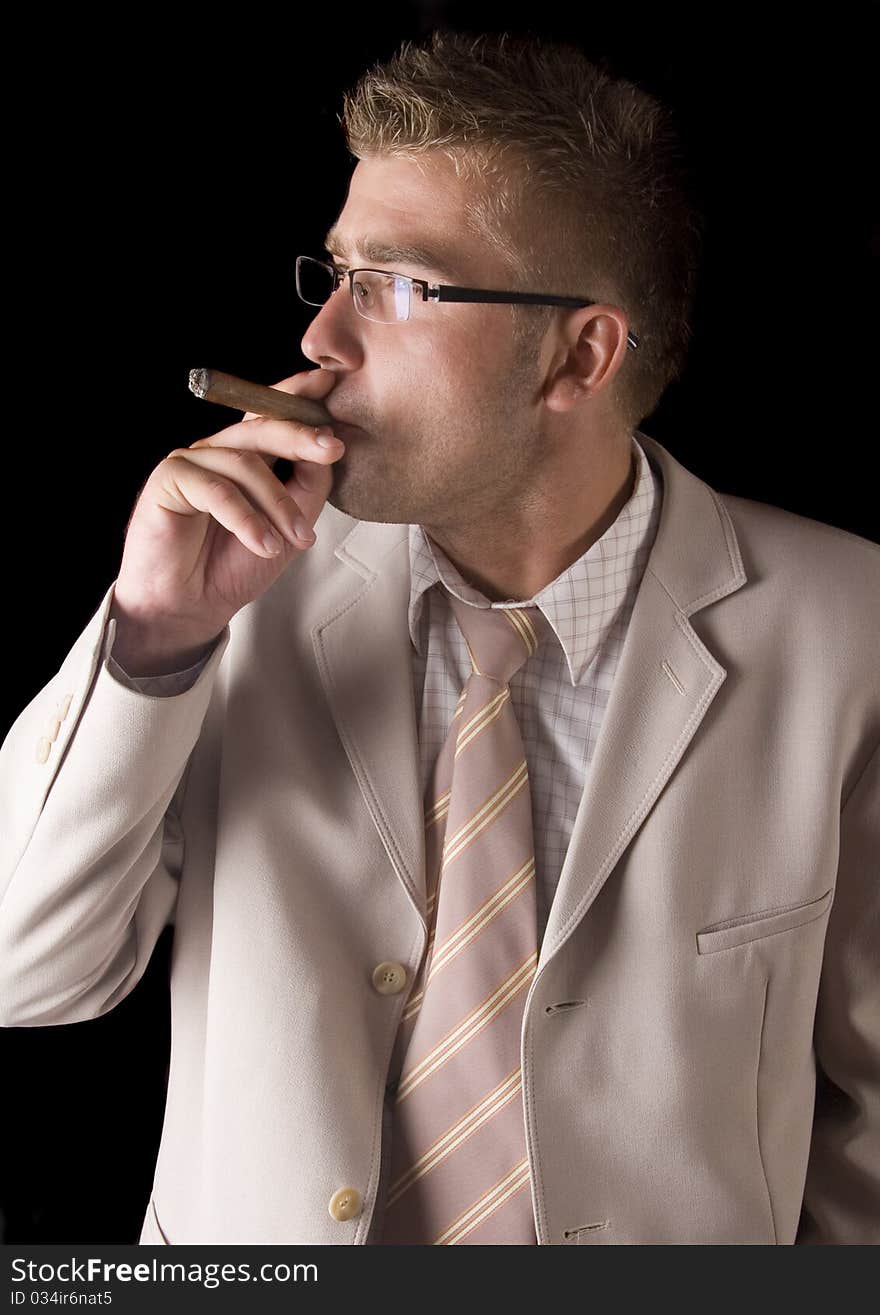 Businessman smoking cigar