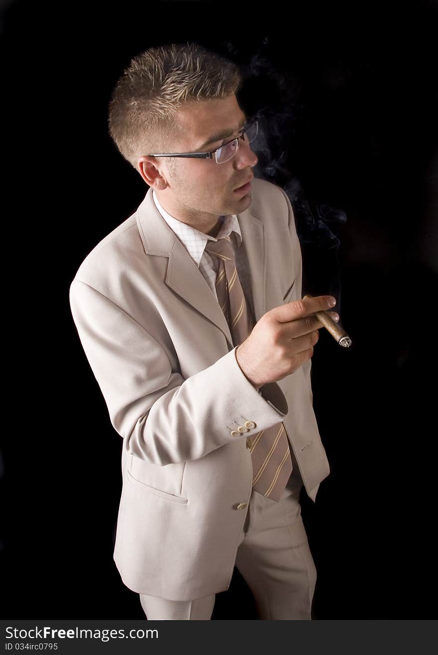 Businessman smoking cigar