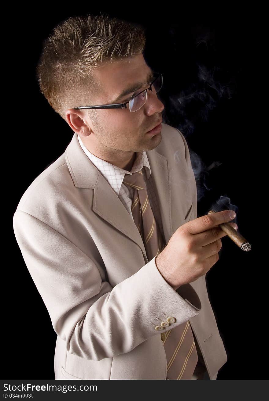 Businessman smoking cigar