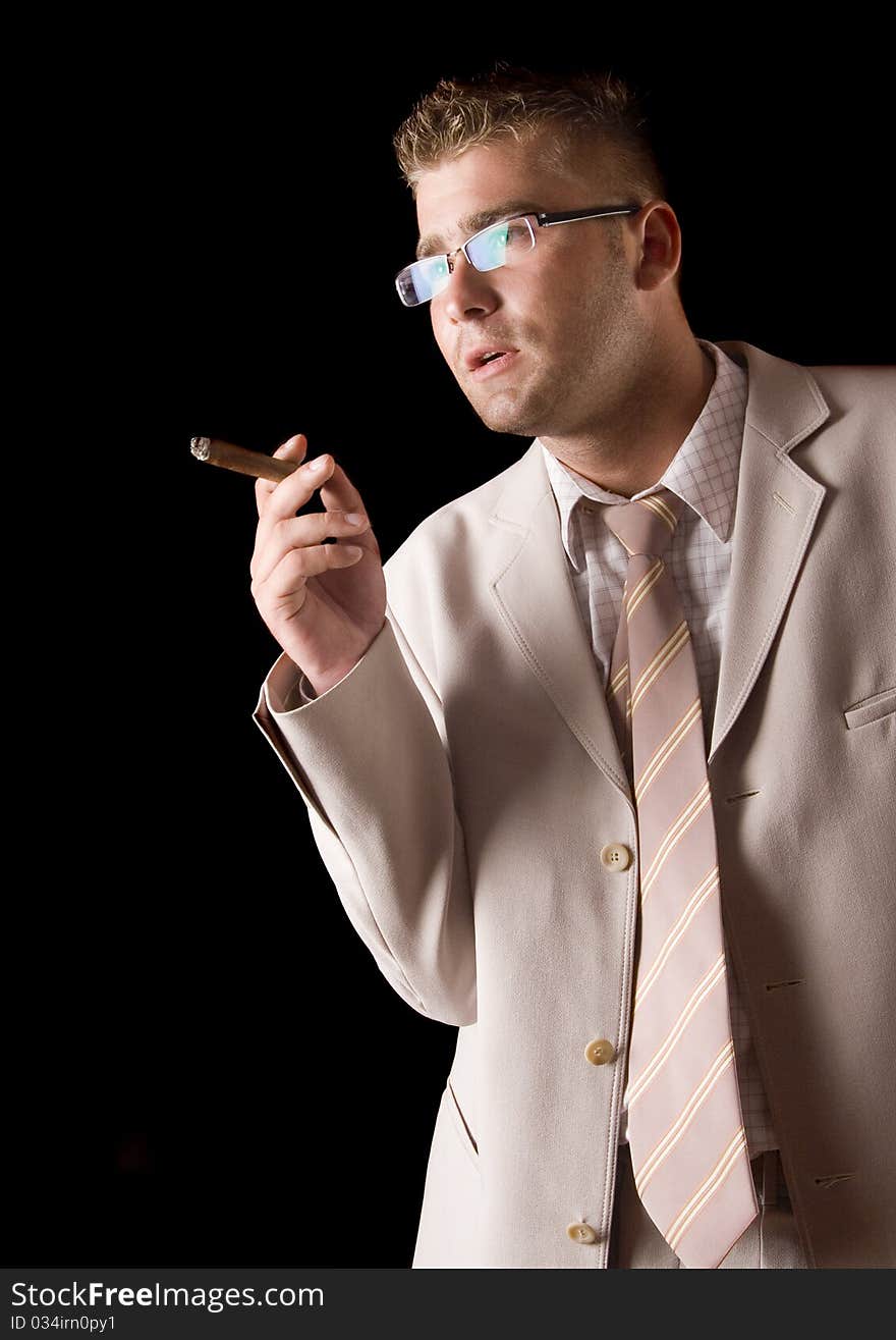 Businessman smoking cigar