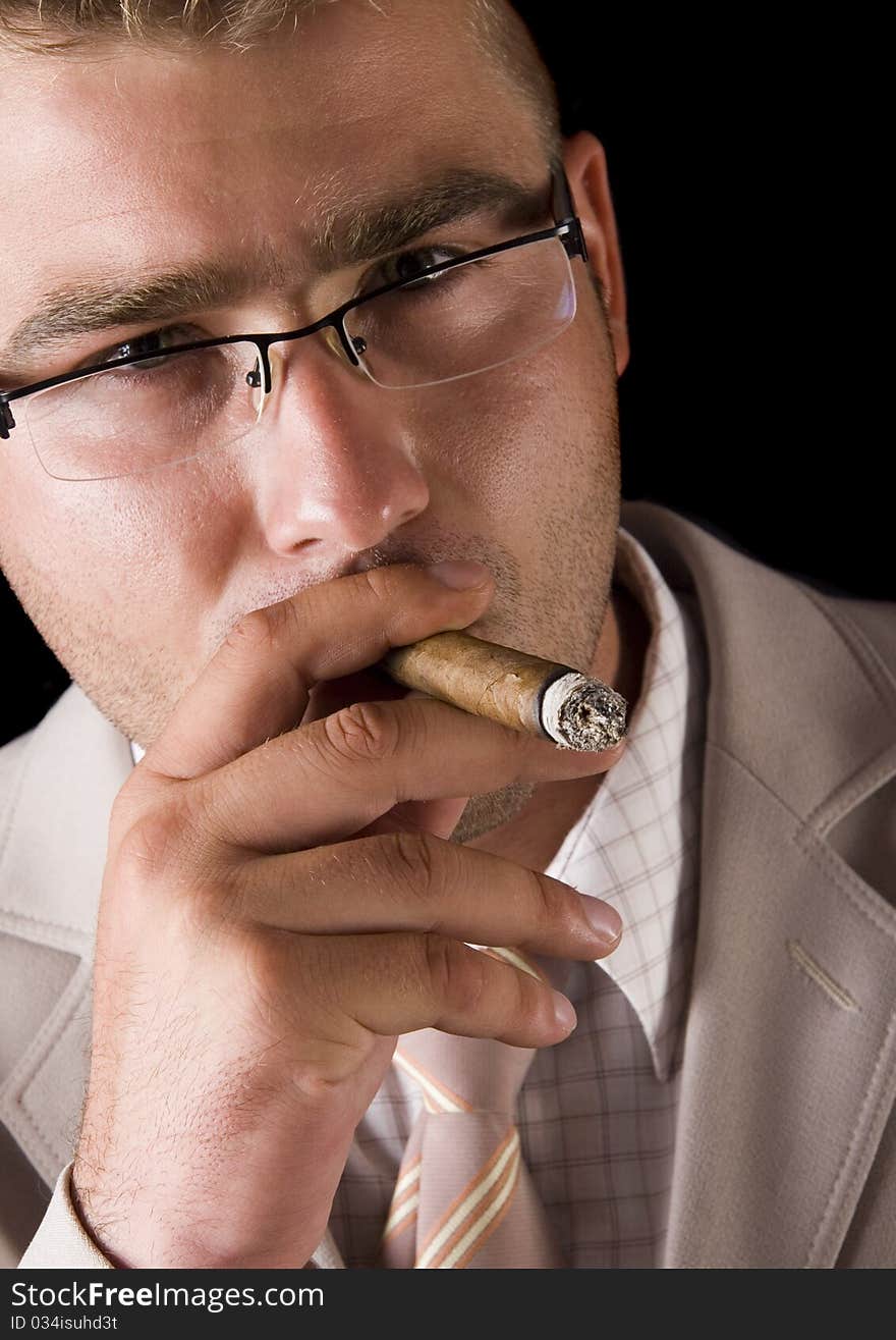 Businessman smoking cigar