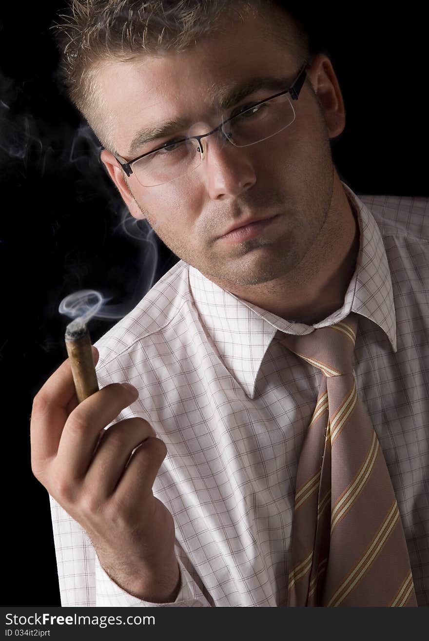 Businessman smoking cigar