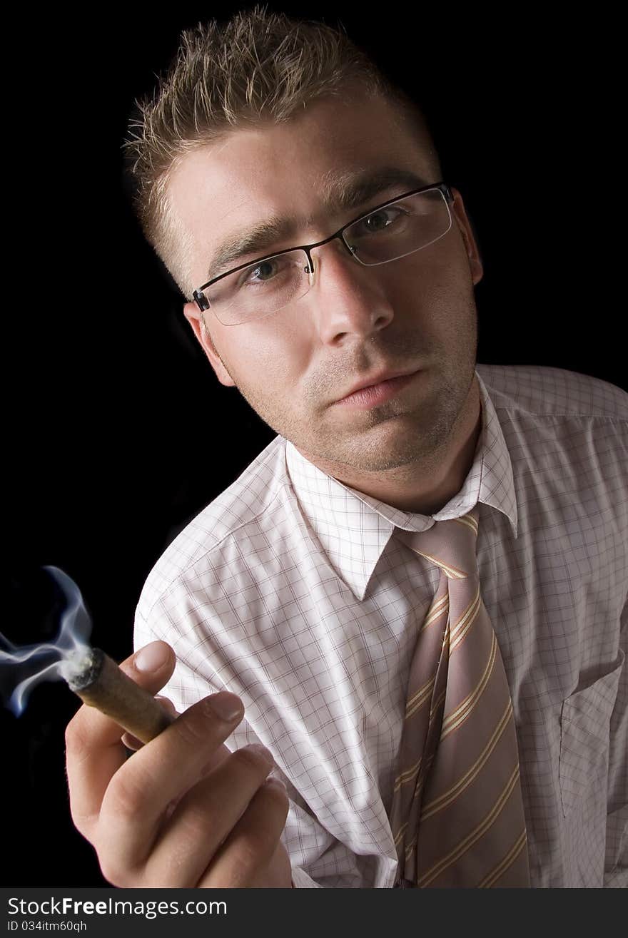 Businessman smoking cigar