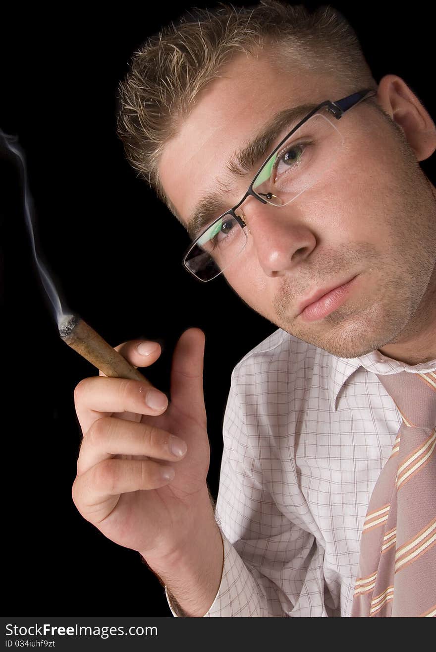 Businessman smoking cigar