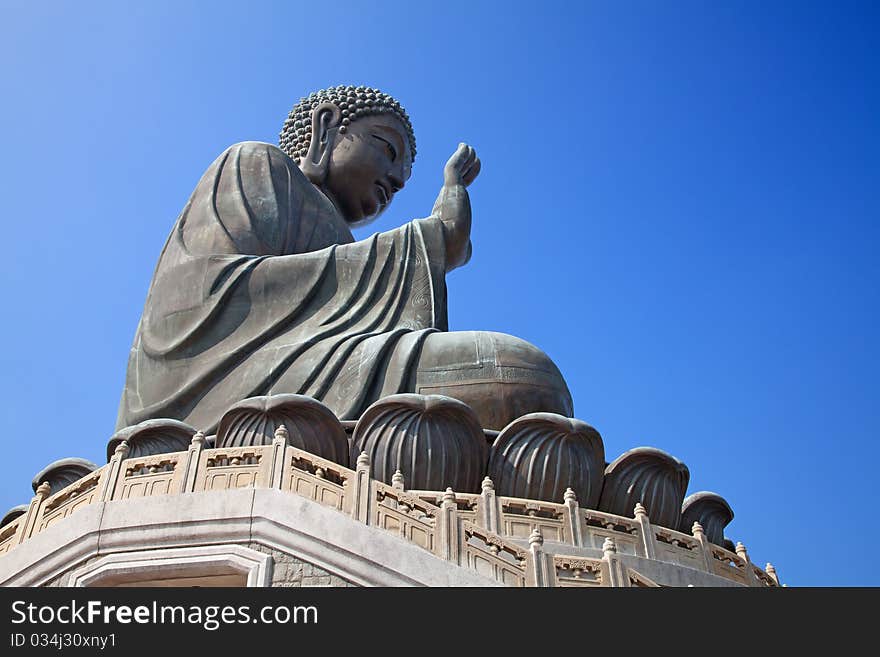 Buddha statue sitting in have no fear mudra on the Lantau island (Hong Kong)