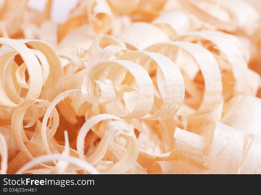 Wooden shaving texture. Macro view of spiral shavings.