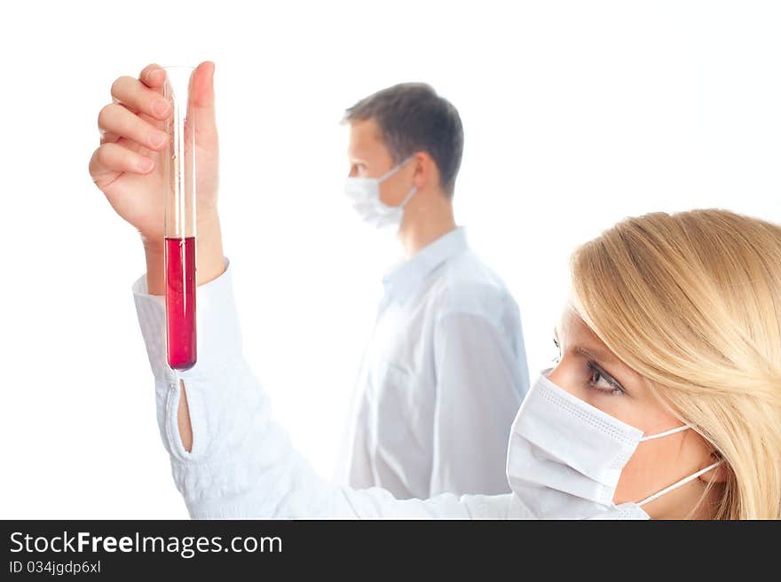 A female and male scientist working in a lab white background