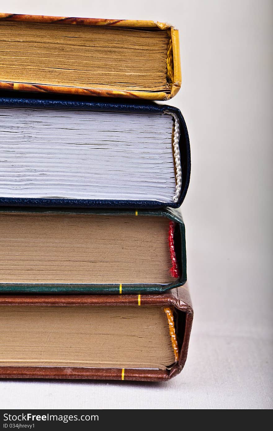 Cute stack of books on white background