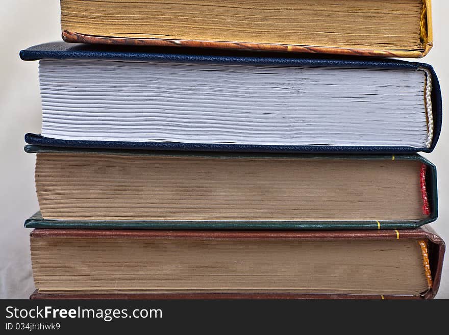 Stack of several books on white background