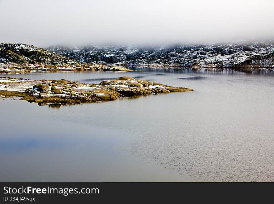 Mountain landscape, lake and fog