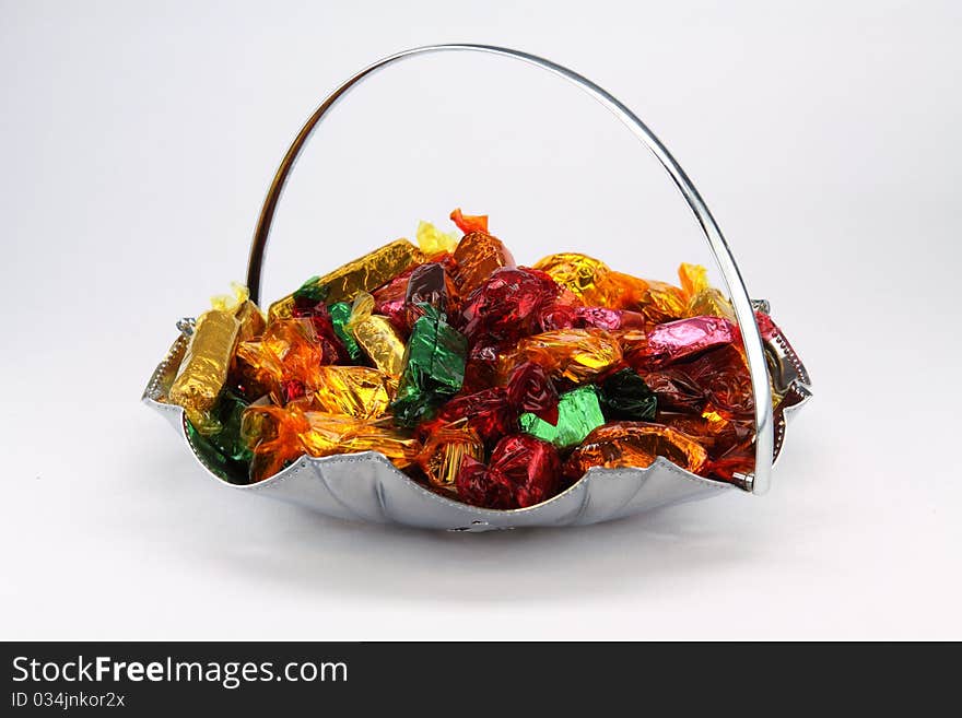 Isolated bowl of assorted chocolate sweets. Isolated bowl of assorted chocolate sweets