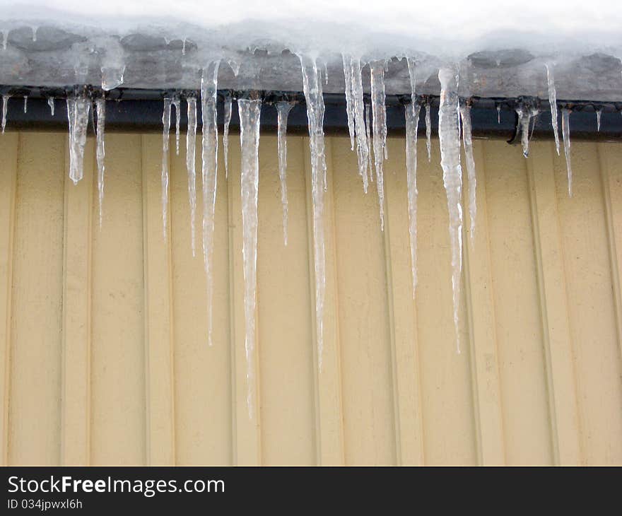 Melting icicles on the roof