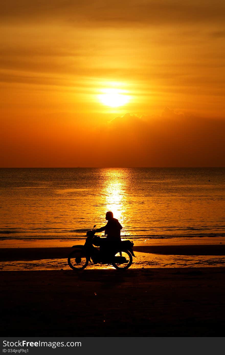 Motorcycling at beach on Langkawi island, Malaysia